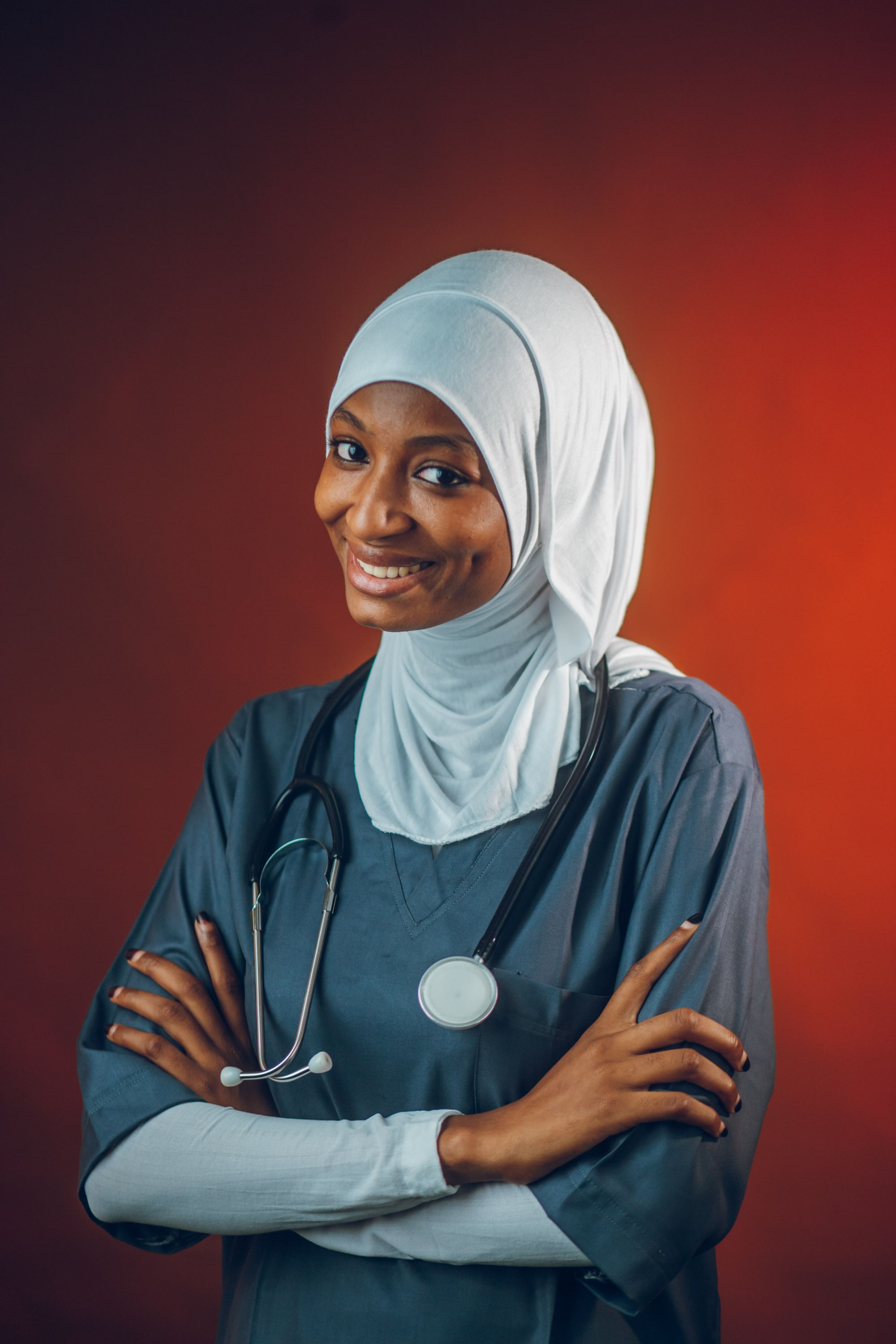 Female clinician wearing a hijab and scrubs, representative of Dubai’s diverse medical community.