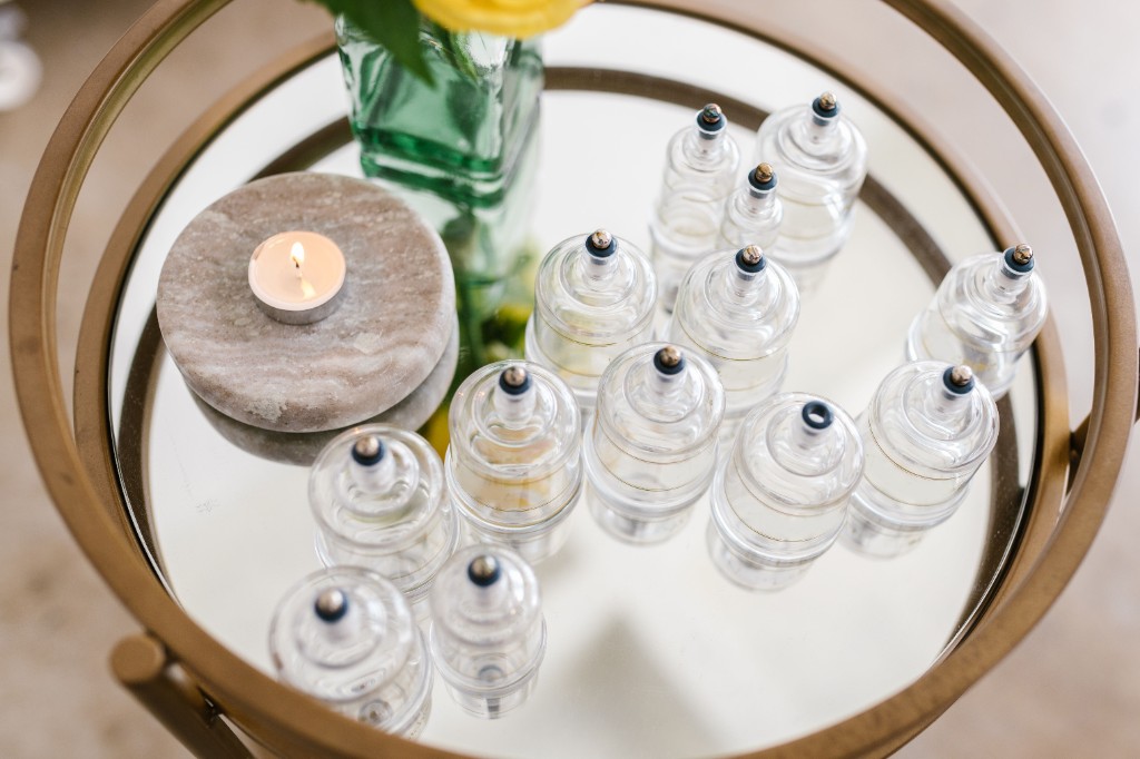 Clinical cupping cups prepared on a treatment tray, used to represent Clinova’s cupping visits in Dubai.