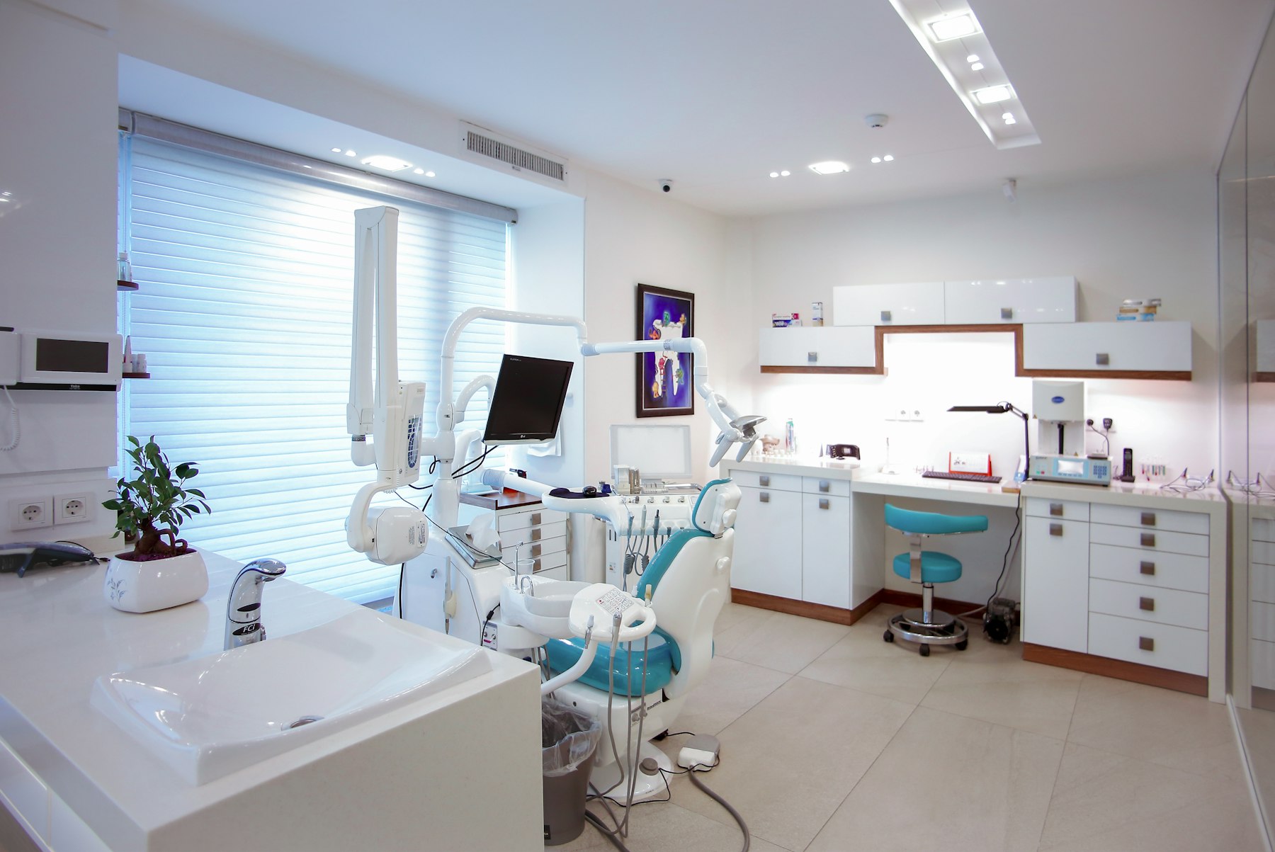 Contemporary dental treatment room with soft lighting, used as representative clinical photography.